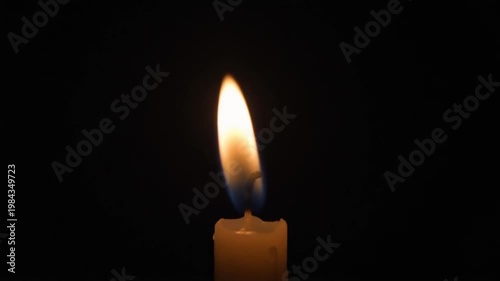 Burning Candle Flame In Dark Atmospheric Setting