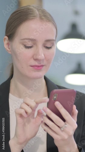 Wallpaper Mural Businesswoman using Smartphone for Browsing Internet, Vertical Video Torontodigital.ca