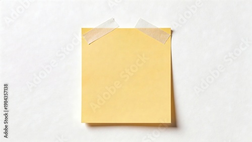 Yellow sticky note on white surface