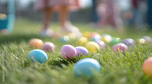 Pastel eggs scattered on grass in blurred outdoor easter scene