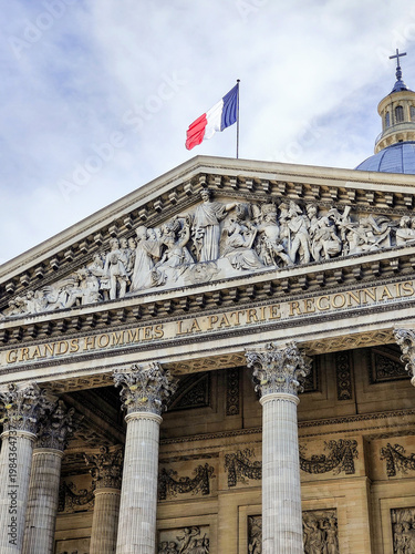 Photography Panthéon pediment frieze and French flag with dramatic cloudy sky, Paris, France