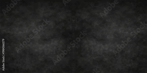 Abstract a detailed close-up shot of a textured chalkboard surface with a sense of the gritty tactile feel, capturing the rich, deep tones. 