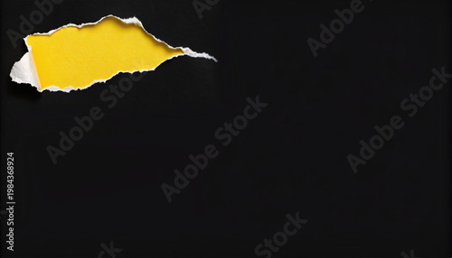 Torn paper hole revealing yellow background marketing concept with copy space