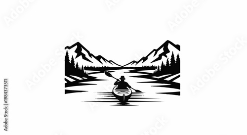 Silhouette of a kayaker paddling through calm waters towards distant mountains