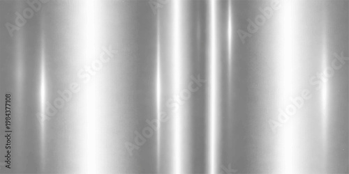 A polished silver brushed metal texture background with a seamless stainless steel pattern on a shiny gray aluminum surface for an industrial chrome backdrop