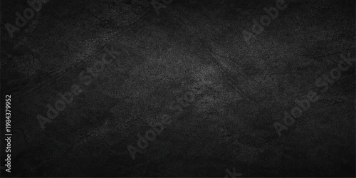 A dark and black grunge background features a textured stone surface with scratched concrete patterns and a vintage gray wall design for a dirty blackboard backdrop