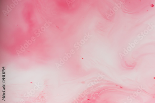 Soft pastel pink ink diffusion in water abstract background