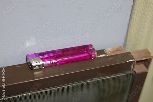 Close-up of a translucent purple disposable lighter