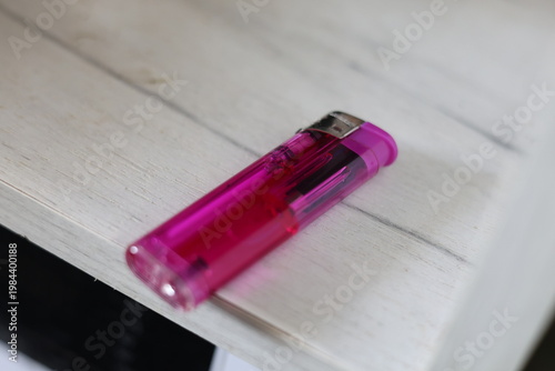 Close-up of a translucent purple disposable lighter