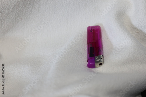 Close-up of a translucent purple disposable lighter