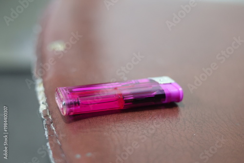 Close-up of a translucent purple disposable lighter