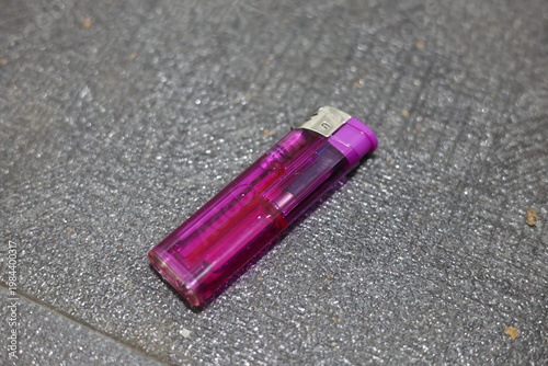 Close-up of a translucent purple disposable lighter