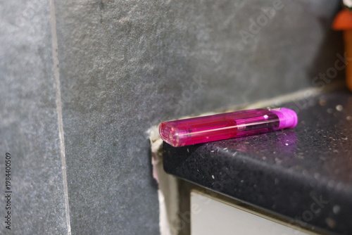 Close-up of a translucent purple disposable lighter