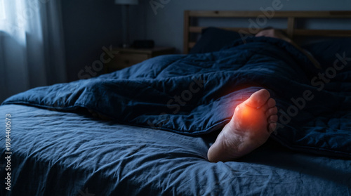 Foot pain gout attack in bed at night, red toe inflammation and leg under blanket
