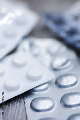 Medication safety scene. Closeup of pills and blister packs in laboratory setting