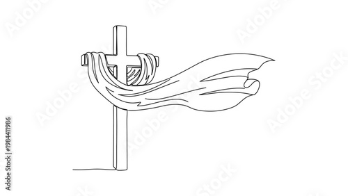 a hand holding a cross with ribbons.