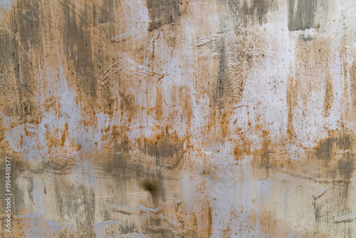 Rust and stains on weathered concrete wall surface