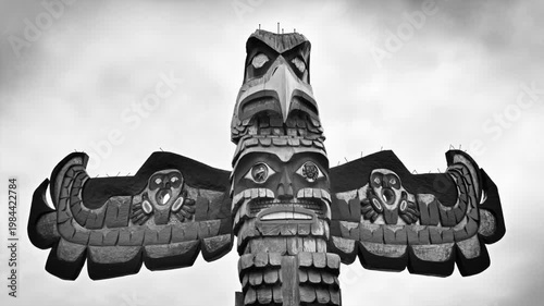 Simulated 1930's style film of  an eagle Totem Pole in British Columbia , Canada	