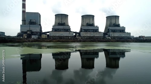 Wallpaper Mural Industrial power plant with cooling towers reflecting in calm water on a cloudy day Torontodigital.ca