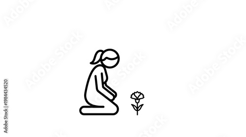 Woman Kneeling Beside a Flower in Remembrance