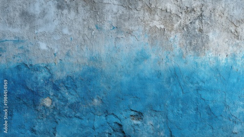 Textured cement wall with cracks, fading gray top and gradient blue paint peeling at the bottom.
