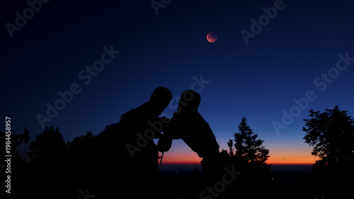 Amateur astronomer using binoculars for observing stars, planets, Moon and other celestial objects.