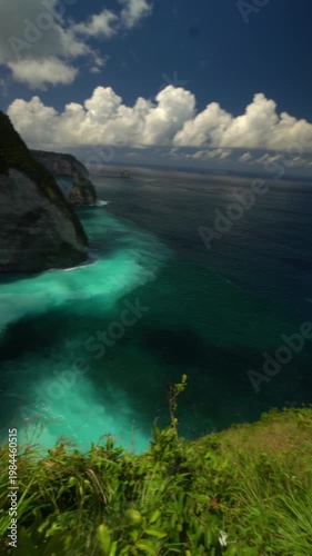 Cinematic view of Kelingking Beach on Nusa Penida, Bali, with dramatic cliffs, turquoise ocean and epic tropical landscape.