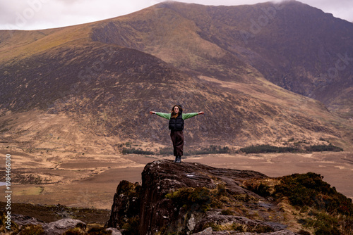 Person enjoying panoramic Irish mountain view nature landscape