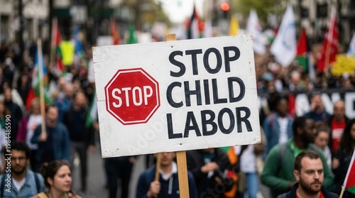 Public demonstration for child rights activism with an activist displaying a stop child labor placard.