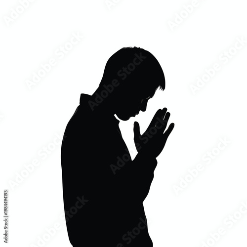 Silhouette of a Person Praying or Meditating with Hands in Silent Reflection