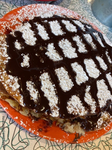 Quadro em tela decadent triple chocolate pancake topped with chocolate sauce and powdered sugar