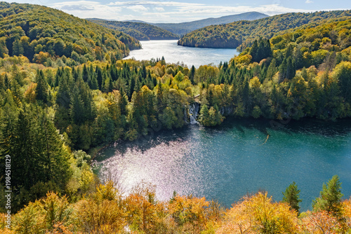 Quadro su tela Stunning autumn view of Plitvice Lakes National Park in Croatia, small waterfall flowing into a crystal clear turquoise lake surrounded by colorful forests, UNESCO World Heritage site, Lika, Croatia