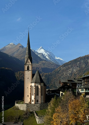 Alpine church with mountain backdrop in the Swiss Alps, capturing traditional village architecture, scenic European charm, and peaceful travel atmosphere in Switzerland.