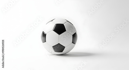 A soccer ball on a clean white surface with a subtle shadow on transparent background