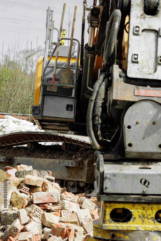Fototapeta premium Close up of demolition excavator working on construction site