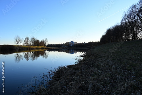 evening reflection of blue skies on water surface vltava river in ceske budejovice