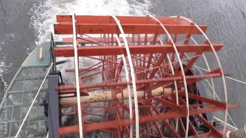 an overhead shot of the wheel of a paddleboat sailing on the chena river near fairbanks, alaska of the usa