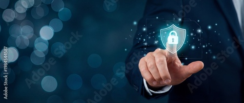 Businessman Touching Digital Security Shield with Lock Symbol on Blue Background in Modern Technology Concept