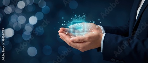 Hands Holding Digital Concept with Sparkles and Light Effects on a Dark Background