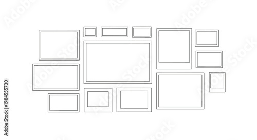 Creative arrangement of empty rectangular and square photo frames on a white wall provides a template for a gallery wall layout.