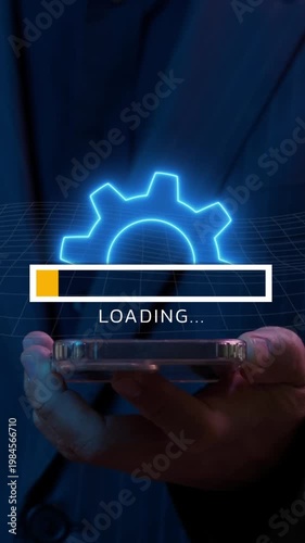 Concept for teamwork, target, motivation, mission, achievement, growth and success business. Businessman using smartphone to show animation of neon line cogwheel with loading bar.