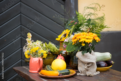 Rustic Autumn Table With Flowers And Fresh Vegetables