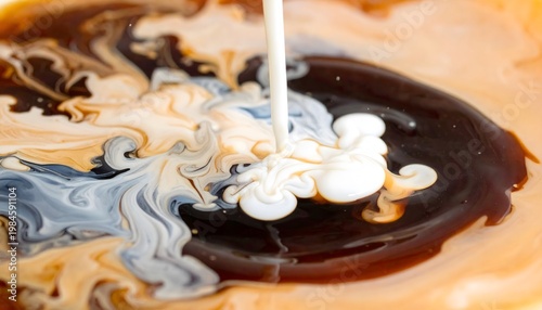 Swirling mix of milk and coffee.