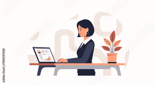 woman working on laptop at desk.