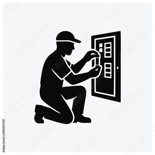 Silhouette of electrician working on electrical panel
