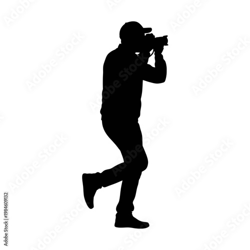 Black silhouette of a photographer taking a picture.