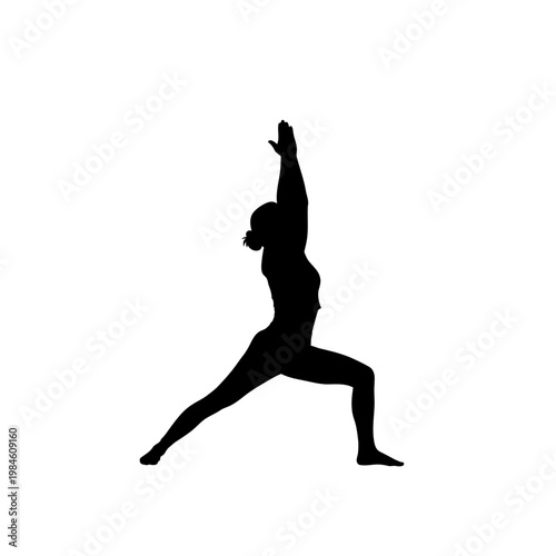 Black silhouette of a woman performing yoga warrior pose.