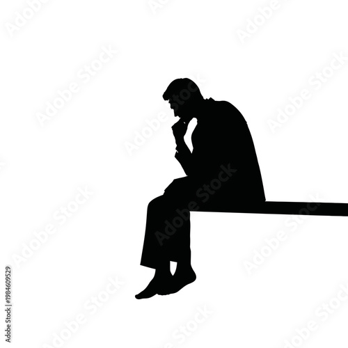 Silhouette of a man sitting and thinking deeply.