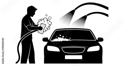 Silhouette of a man washing a car with a sponge and hose during a sudsy cleaning
