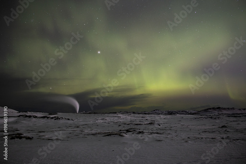 Aurora borealis over Reykjanesviti lighthouse and geothermal vent Iceland